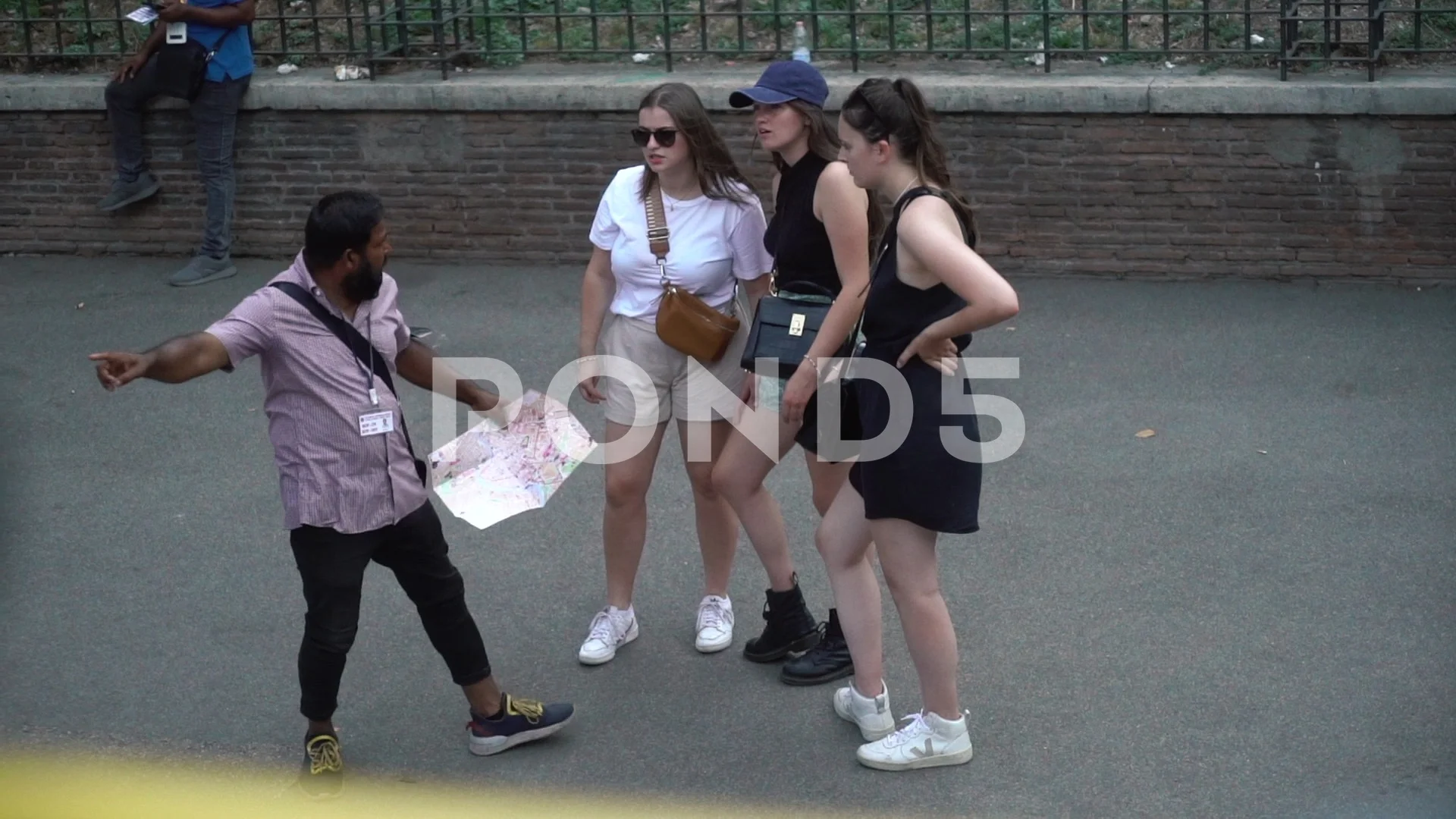 Rome, Italy. 26.08.2022. girls on the street look at the map of the city