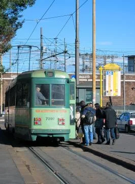 ROME, ITALY - Dec 25, 2011: Passengers boarding a tram in Rome, Italy Stock Photos