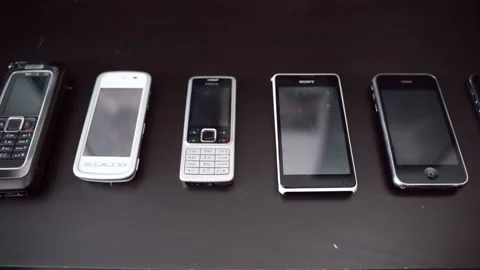 ROME, ITALY - MAY 6, 2020: A range of cell phones of different generations, old 스톡 동영상 142402753