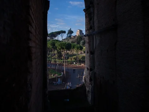 Rome, Italy - View through a window of Colosseum - Timelapse with motion Stock Footage 75277738
