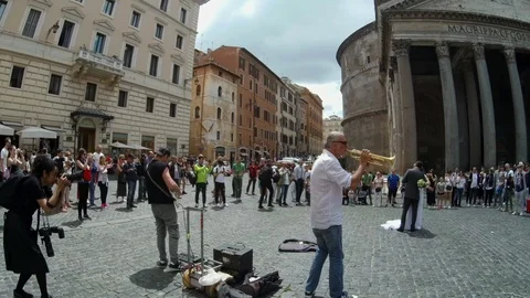 Rome - Just married couple dancing at Pantheon square with street musicians Stock Footage 90377751