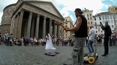 Rome - Just married couple dancing at Pantheon square with street musicians Stock Footage 90377952