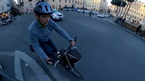 Rome, a man rides a bicycle in the ancient center at dusk, 360 effect Stock Footage 106432572