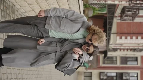 Rome, May 1, 2023: Vertical video. A stylish guy and a girl in an embrace Video stock 316319617