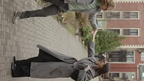 Rome, May 1, 2023: Vertical video. A stylish guy and a girl in an embrace Video stock 316320564