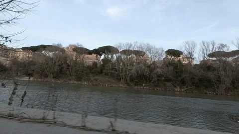 Rome, moving view along Tiber River and his house boats at dusk Stock Footage 104402024
