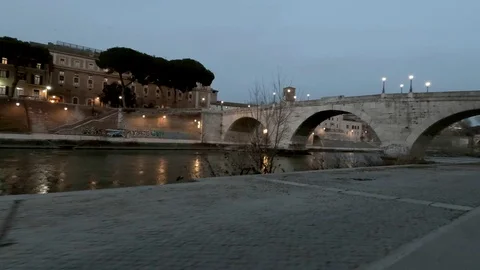 Rome Moving view of  Tiber River and Tiberina Island at dusk,  bicycle lane Stock Footage 104401729