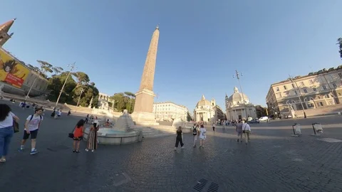 Rome, Piazza del Popolo, around the obelisk by bike at sunset, people walking Stock Footage 112876374