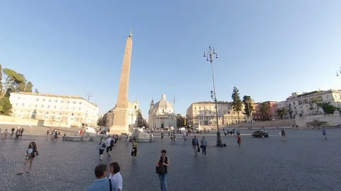 Rome, Piazza del Popolo, around the obelisk by bike at sunset, people walking Stock Footage 112876450