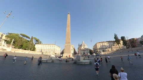 Rome, Piazza del Popolo, around the obelisk by bike at sunset, people walking Stock Footage 112876484