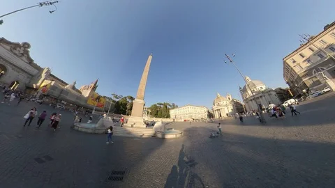 Rome, Piazza del Popolo, around the obelisk by bike at sunset, people walking Stock Footage 112991382