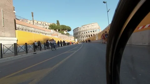 Rome Running towards the Coliseum, view from the wheel of a cyclist Stock Footage 88801683
