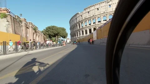 Rome Running towards the Coliseum, view from the wheel of a cyclist Stock Footage 88801840