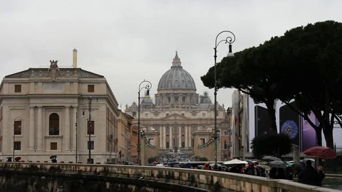 Rome, Saint Peter Dome from far in a rainy day with tourist Stock Footage 86757160