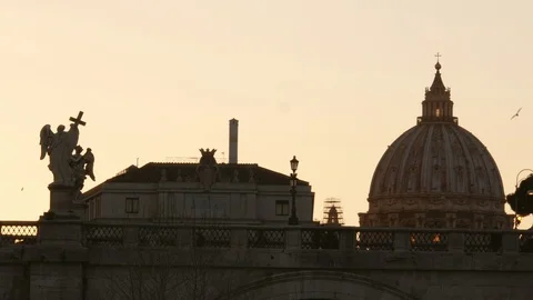 Rome Saint Peter Dome seen from far at twilight with birds in the sky Video stock 103627412