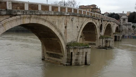Rome - View of swollen Tiber river and a Medieval Bridge Stock Footage 87333661