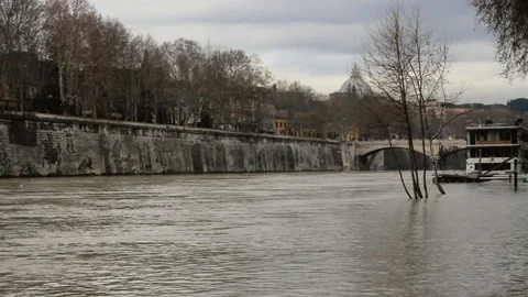 Rome - View of swollen Tiber river with Vatican Dome in the background Stock Footage 87333695