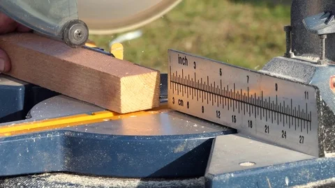 Roof construction building. Work on circular saw. Sawing wooden elements. Stock Footage 97311917