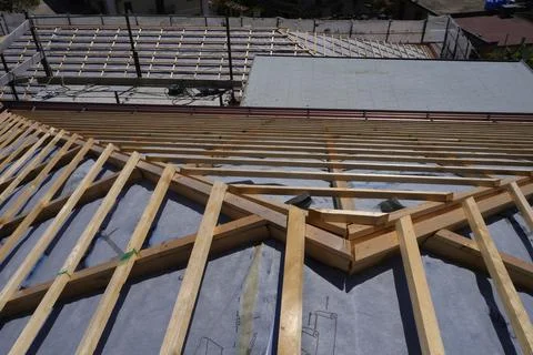 Roof construction in progress. Photos