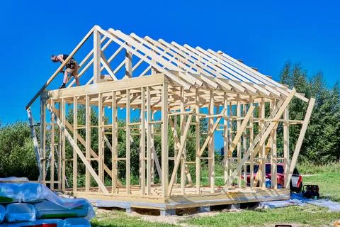 Roof framing construction forms upper structure of timber frame house, youn.. 写真素材