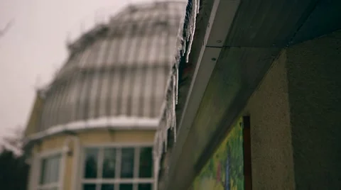 Roof with icicles dripping water Stock Footage 59174042