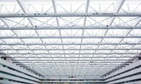 The roof is made of light material inside the modern building Stock Photos
