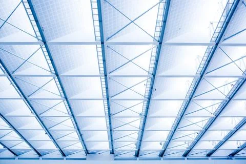 The roof is made of light material inside the modern building Stock Photos