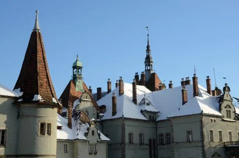Roof of medieval romantic style castle covered with the snow, Ukraine Stock-Fotos