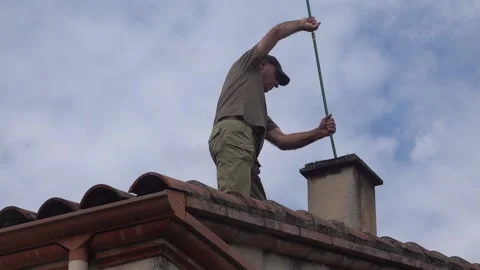 Roof work to clean the chimney. Stock Footage 160137543