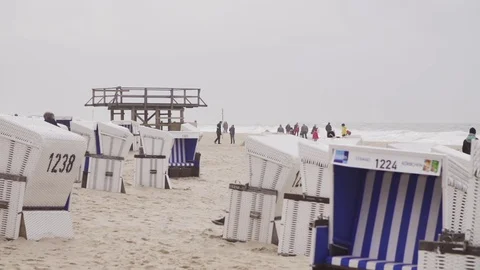 Roofed wicked beech chairs on beach Video stock 71566395