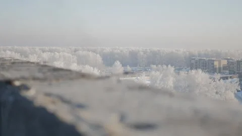 The roofer applies glue to the parapet with a roller. Winter in the North on a Video stock 123724873