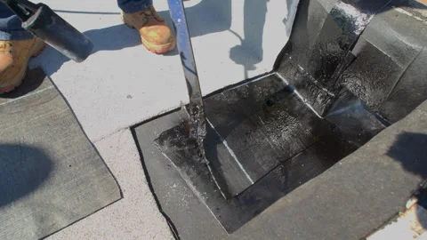 Roofer applying granulated APP Torch Down  Stock Footage 328283411