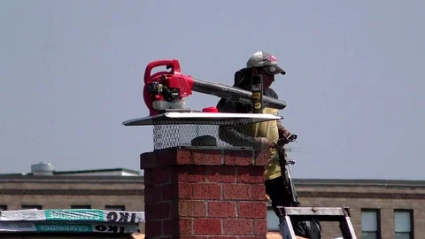 Roofer begins work on replacement of home's asphalt roof shingles Video stock 122114060