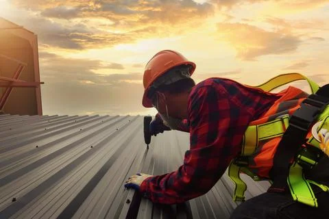 Roofer Construction worker install new roof,Roofing tools Stock Photos