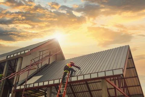 Roofer Construction worker install new roof,Roofing tools Stock Photos