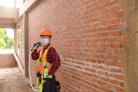 Roofer Construction worker install new roof,Roofing tools Stock Photos