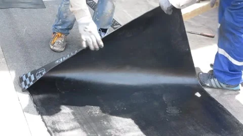 The roofer cuts roofing material Video stock 68891439