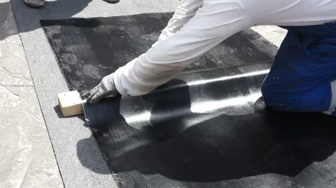 The roofer cuts roofing material Stock Footage 68892339