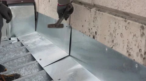The roofer fix metal to a wall Stock Footage 68881707
