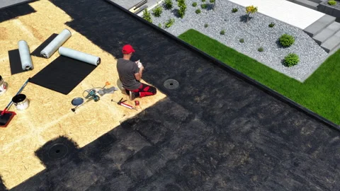 Roofer Installing Membrane on Flat Roof in Residential Area on Sunny Day Stock Footage 313531450