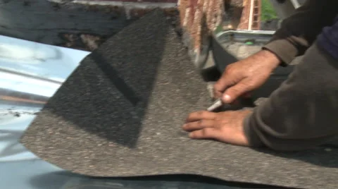 Roofer installing shingles Stock Footage 57714960