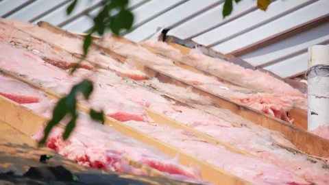Roofer installs the new wood decking on an house. Zoom view Stock Footage 306338384