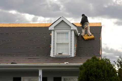Roofer Working On 2 Story Home Stock Photos