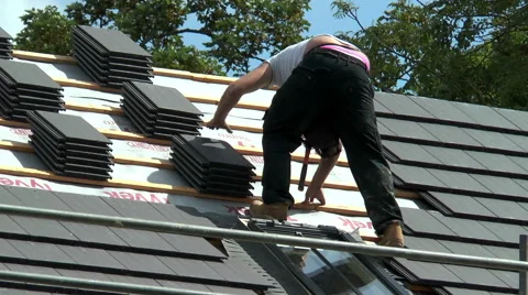 Roofer working on a barn conversion (close view). Video stock 53415431