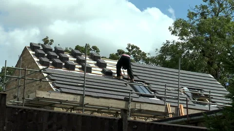 Roofer working on a barn conversion (wide view). Stock Footage 53415572