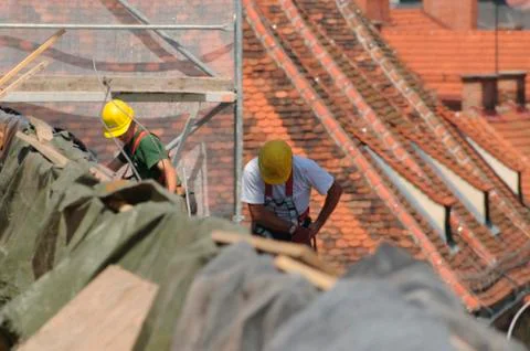 Roofer working on a building Stock Photos