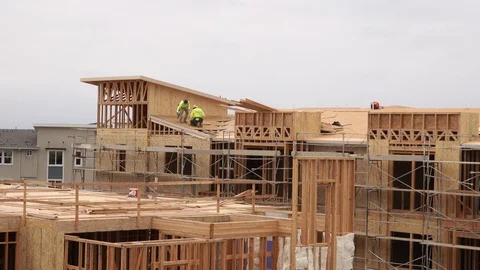 Roofers on condo construction site Stock Footage 109382031