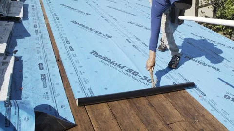 Roofers Installing Plastic Insulation on Residential Home Stock Footage 329402271
