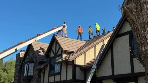 Roofers working on a Spring day. May 8th, 2025, Santa Clarita, CA. Stock Footage 310332720