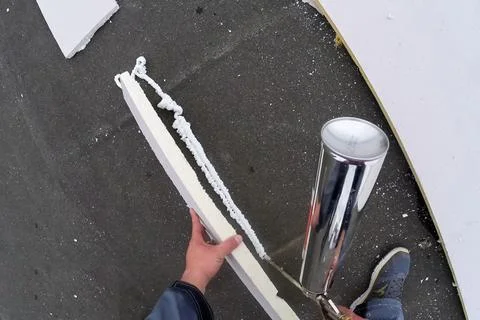 Roofing insulation, installation of insulation sheets on foam Stock Photos